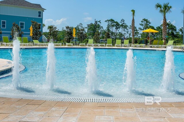 view of pool featuring pool water feature