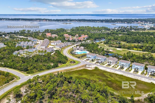 birds eye view of property with a water view