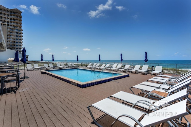 view of swimming pool with a water view