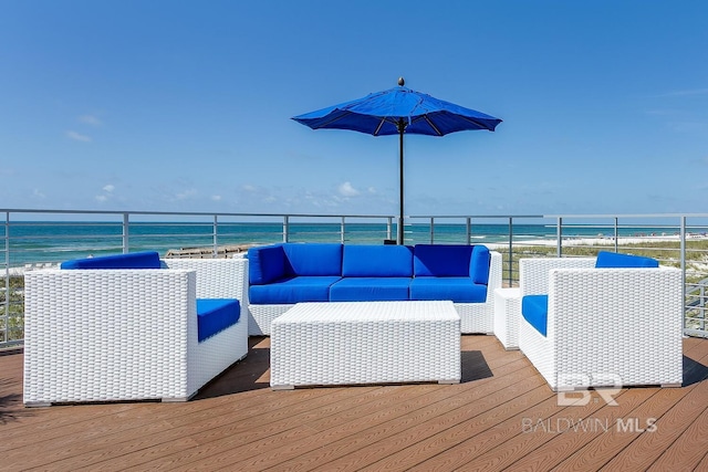 wooden terrace featuring an outdoor hangout area and a water view