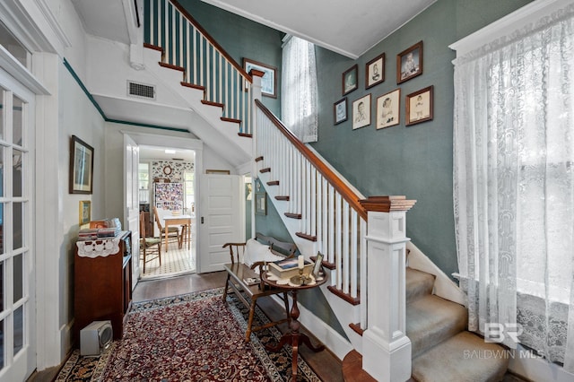 stairway with hardwood / wood-style floors