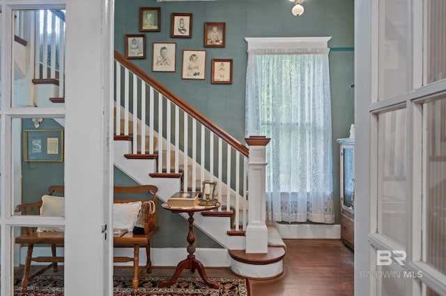 stairway featuring hardwood / wood-style floors