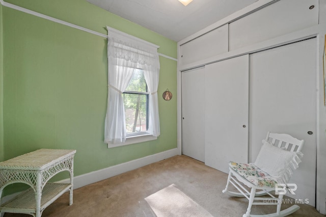 unfurnished bedroom with a closet and light carpet