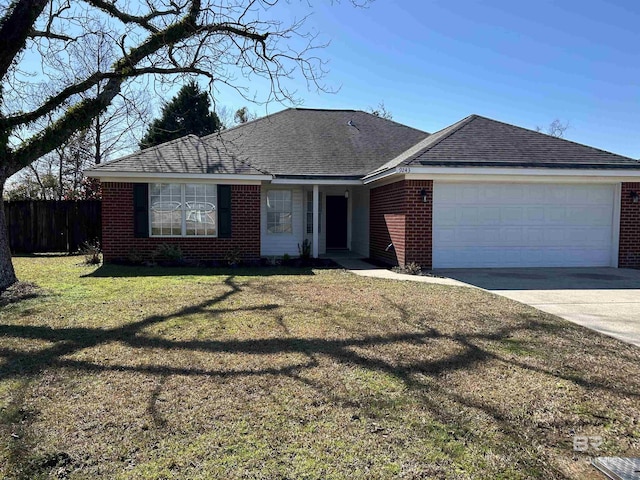 ranch-style home featuring a garage and a front lawn