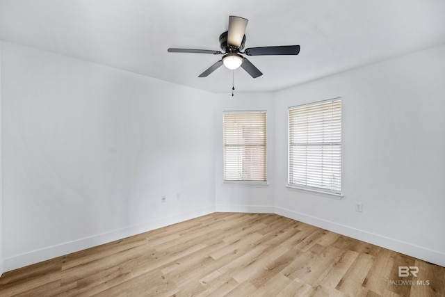 empty room featuring ceiling fan and light hardwood / wood-style flooring