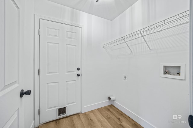 washroom with washer hookup, hookup for an electric dryer, and light wood-type flooring