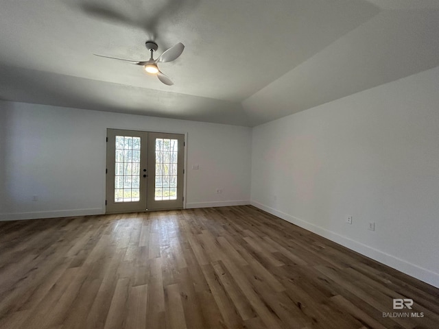 unfurnished room featuring hardwood / wood-style flooring, vaulted ceiling, ceiling fan, and french doors