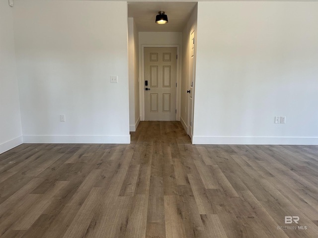 empty room with hardwood / wood-style flooring