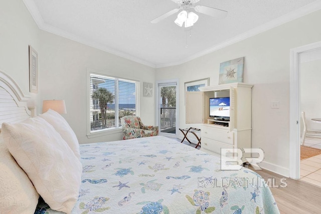bedroom with a ceiling fan, baseboards, ornamental molding, and wood finished floors