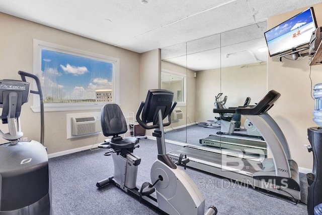 workout area featuring baseboards