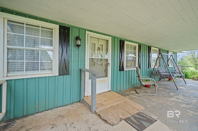 property entrance with board and batten siding