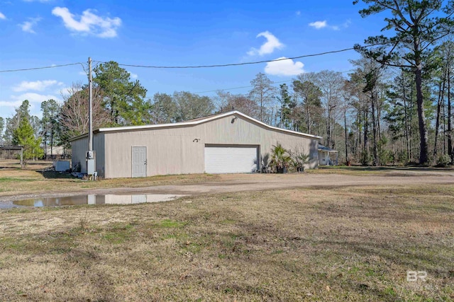 garage with a yard