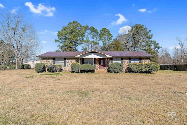 ranch-style home featuring a front yard