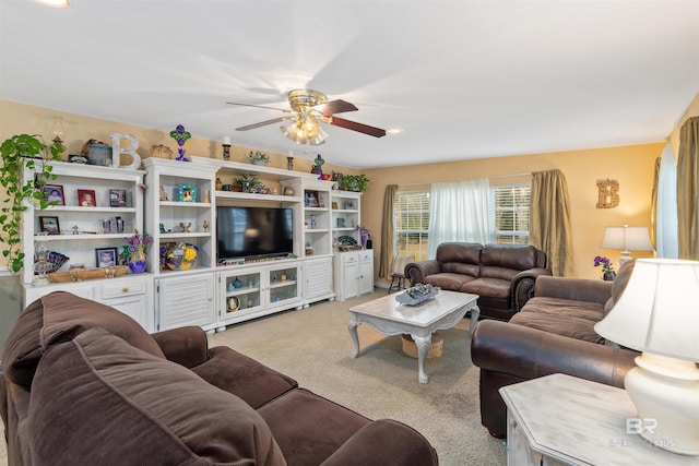 living room with light colored carpet and ceiling fan