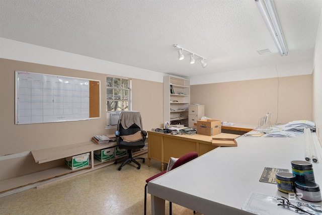 office area featuring a textured ceiling