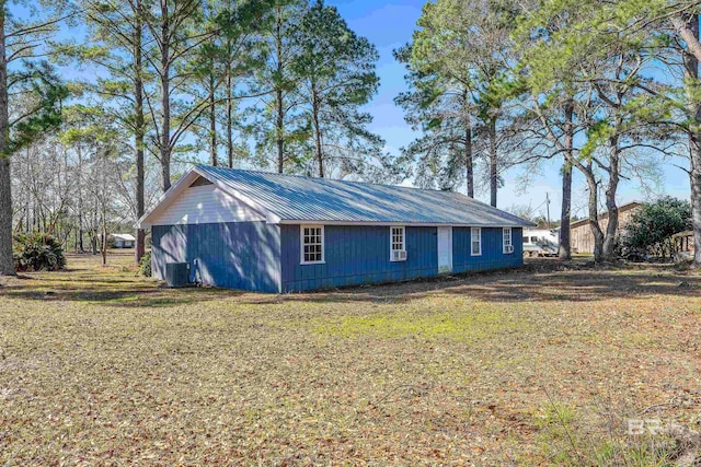 view of property exterior with a yard