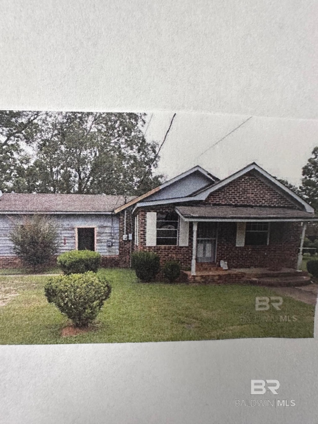 ranch-style house with a front lawn