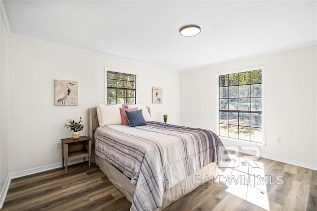 bedroom featuring wood-type flooring and ornamental molding