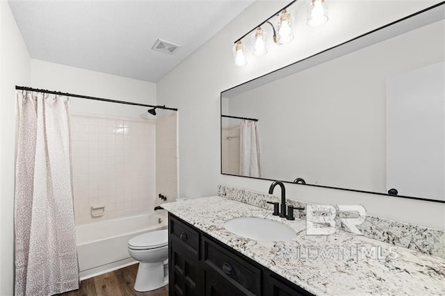 full bathroom featuring shower / tub combo with curtain, vanity, wood-type flooring, and toilet