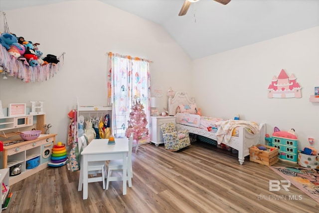 bedroom with hardwood / wood-style flooring, ceiling fan, and vaulted ceiling