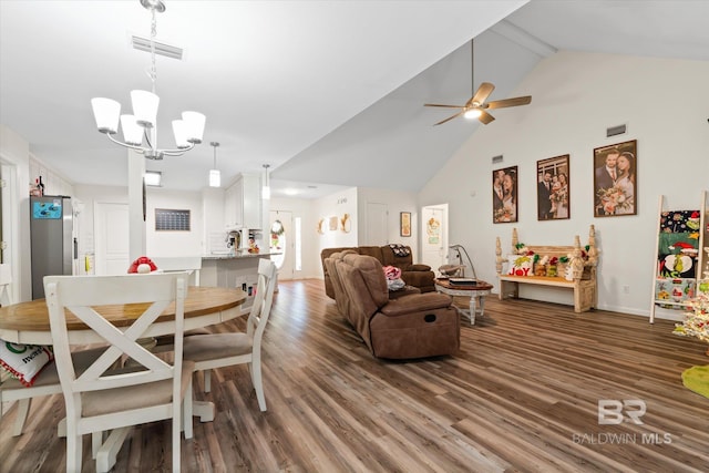 dining area featuring ceiling fan with notable chandelier, beam ceiling, dark hardwood / wood-style flooring, and high vaulted ceiling