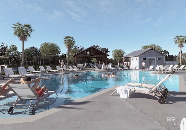 view of pool featuring a patio area and an outdoor structure