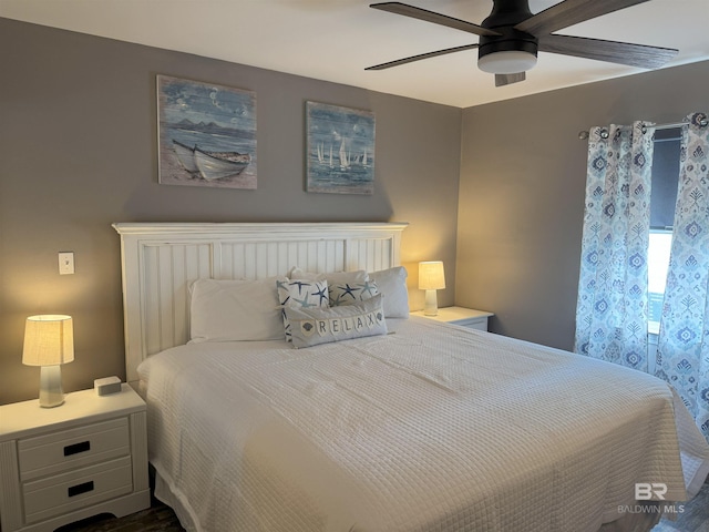 1117 W Lagoon Ave Unit 9, Gulf Shores, AL 36542 - bedroom with a ceiling fan and dark wood-type flooring