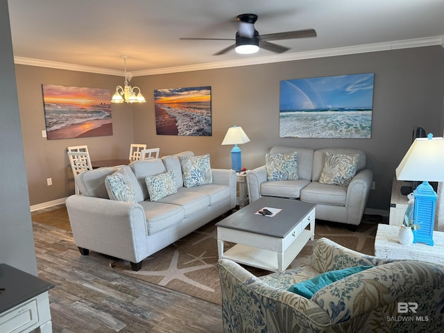 1117 W Lagoon Ave Unit 9, Gulf Shores, AL 36542 - living area featuring crown molding, dark wood-type flooring, a chandelier, a ceiling fan, and baseboards