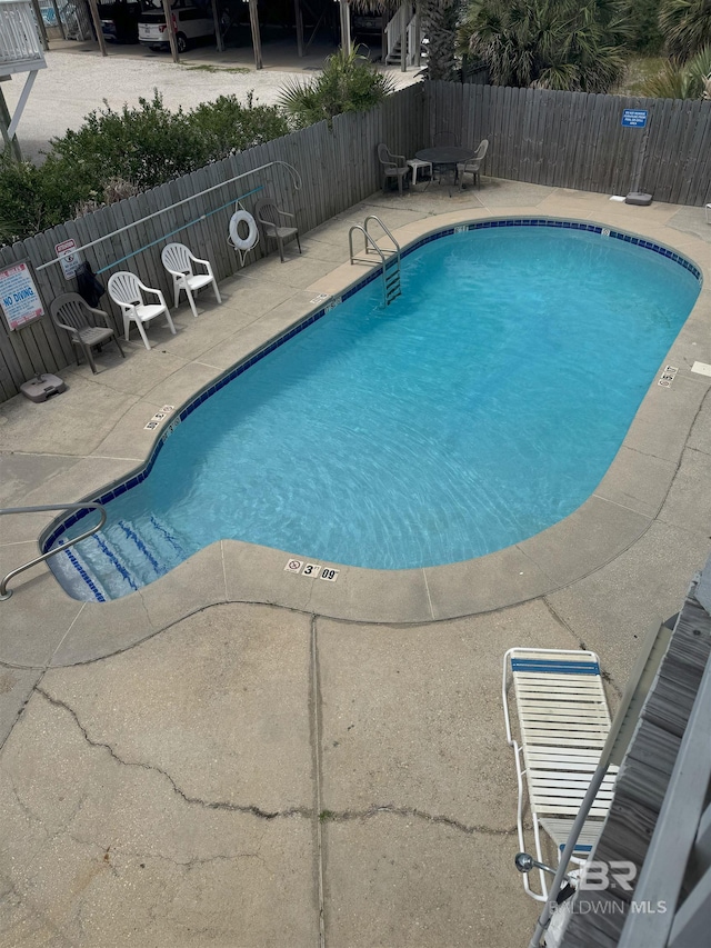 1117 W Lagoon Ave Unit 9, Gulf Shores, AL 36542 - community pool with a patio
