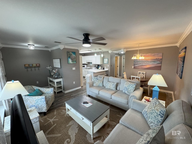 1117 W Lagoon Ave Unit 9, Gulf Shores, AL 36542 - living area with crown molding, dark wood-type flooring, ceiling fan, baseboards, and a chandelier