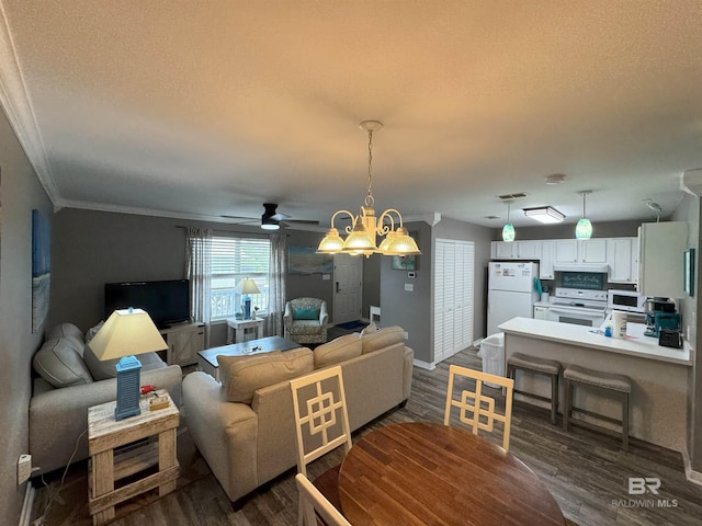 1117 W Lagoon Ave Unit 9, Gulf Shores, AL 36542 - living room with crown molding, dark wood finished floors, a textured ceiling, a ceiling fan, and baseboards