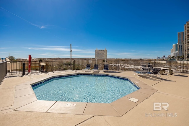 pool with a patio area