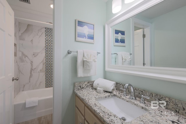 bathroom with bathtub / shower combination and vanity