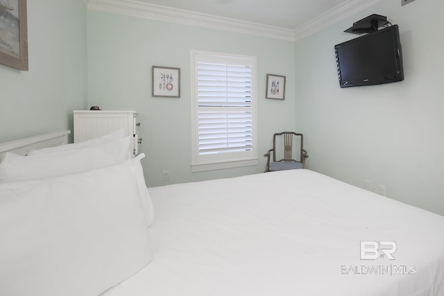 bedroom featuring crown molding