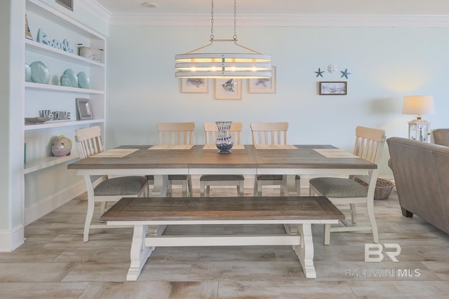 dining room with ornamental molding and visible vents