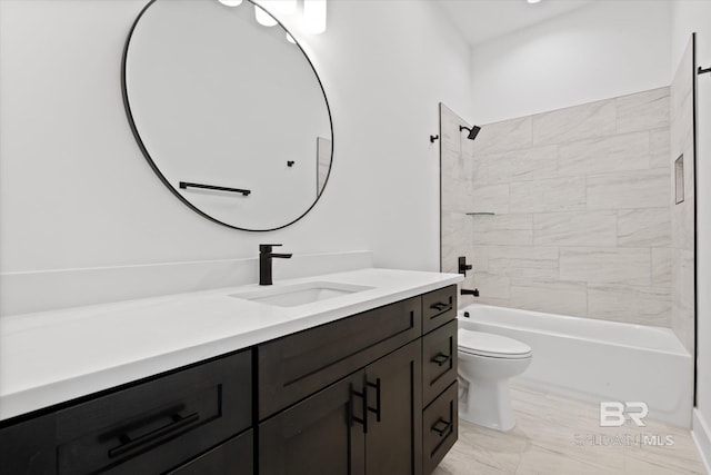 full bathroom with vanity, tiled shower / bath combo, and toilet