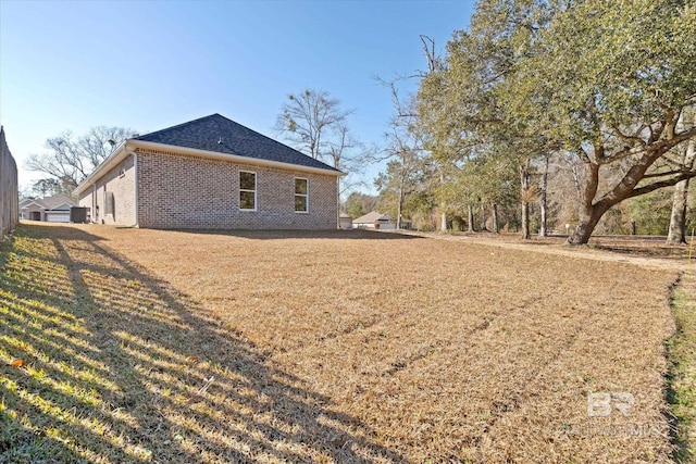 view of property exterior with a yard