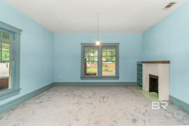 101 S Carlen St, Mobile, AL 36606 - unfurnished living room featuring healthy amount of natural light and a brick fireplace