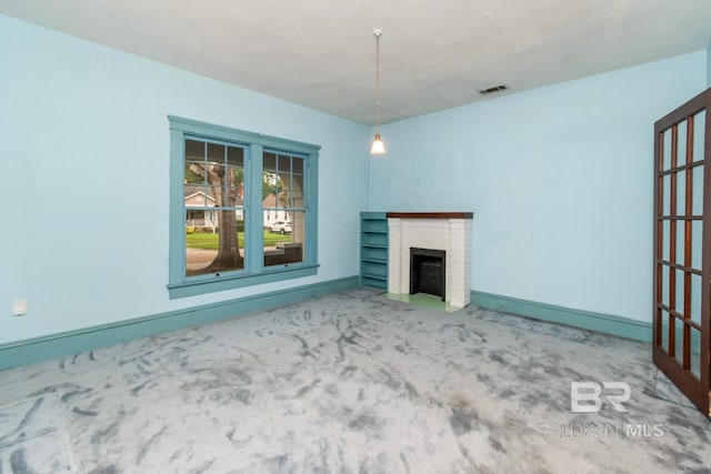 101 S Carlen St, Mobile, AL 36606 - unfurnished living room with carpet and a brick fireplace
