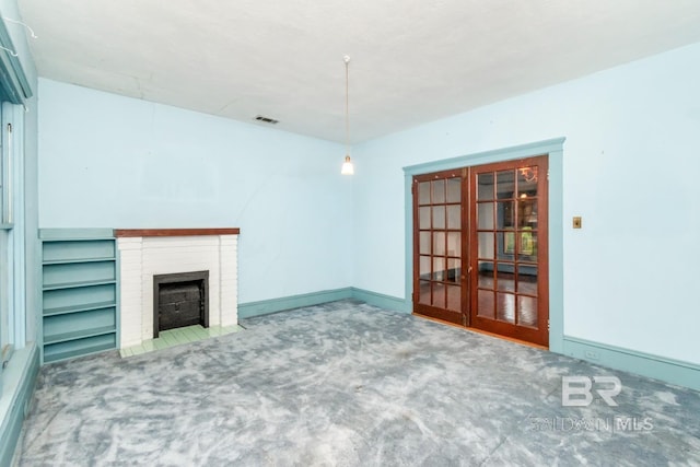 101 S Carlen St, Mobile, AL 36606 - unfurnished living room featuring carpet floors and a brick fireplace