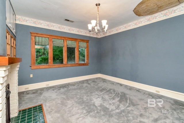101 S Carlen St, Mobile, AL 36606 - carpeted empty room with a chandelier and a fireplace