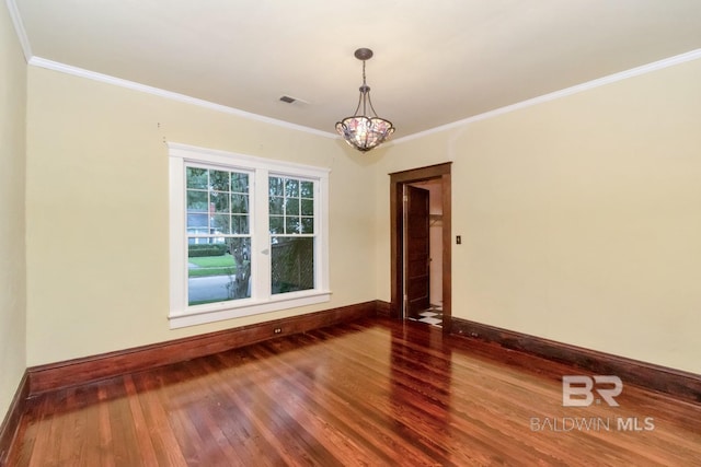 101 S Carlen St, Mobile, AL 36606 - spare room with wood finished floors, ornamental molding, and a chandelier