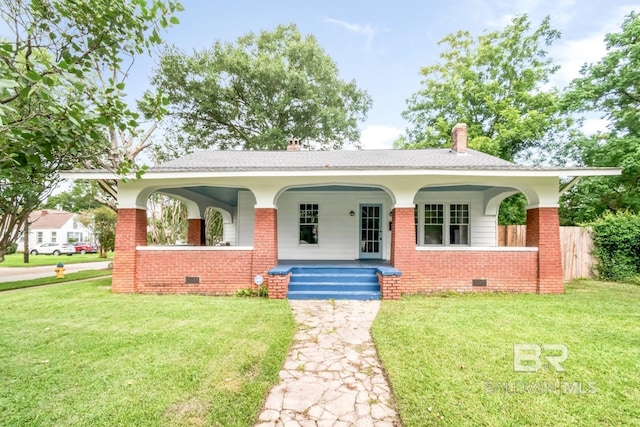 101 S Carlen St, Mobile, AL 36606 - view of front facade with brick siding, crawl space, a porch, a chimney, and a shingled roof