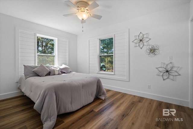 bedroom featuring ceiling fan and dark wood-type flooring