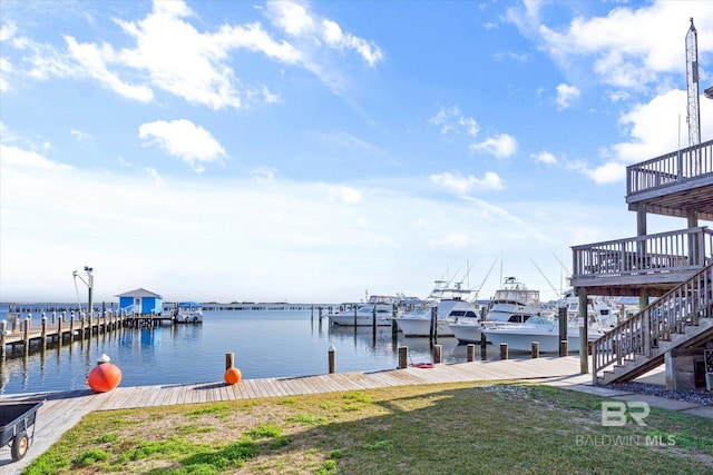 dock area featuring a water view and a lawn