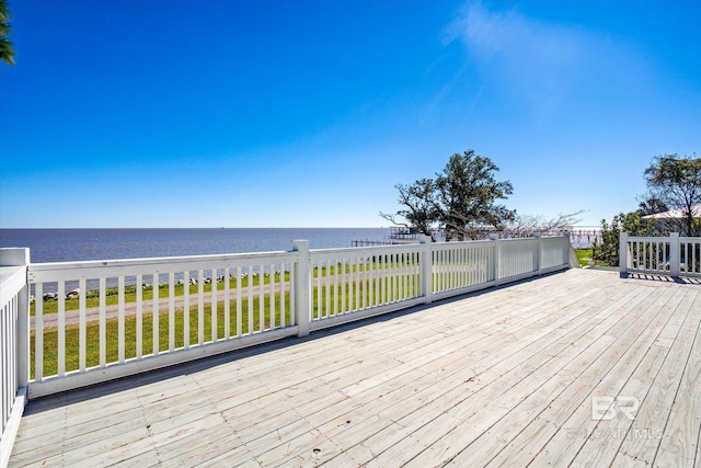 wooden deck with a water view