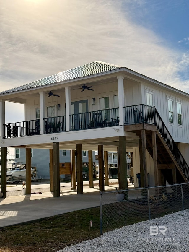 back of property featuring ceiling fan