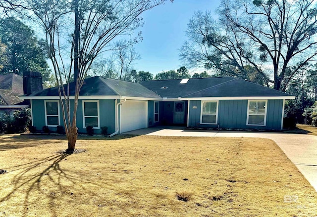 ranch-style house with a garage and a front yard