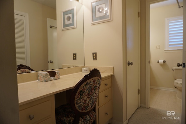 bathroom with vanity and toilet