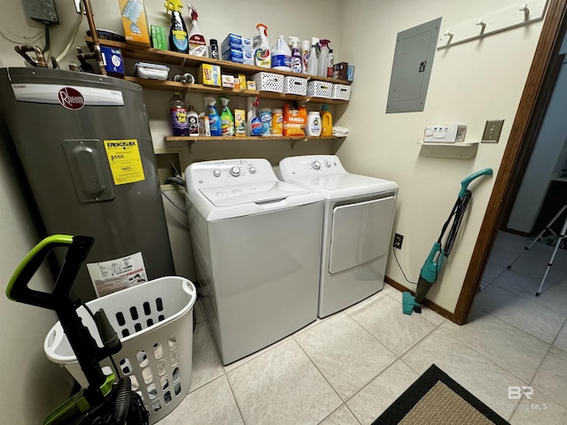 laundry room with light tile patterned flooring, electric panel, and independent washer and dryer